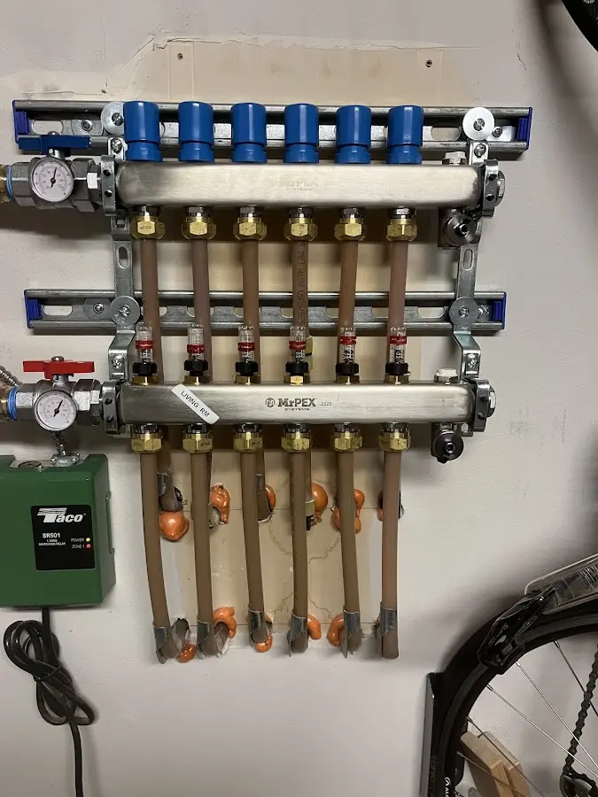 Plumber performing Water Heater Repair at a residential property in Skaneateles